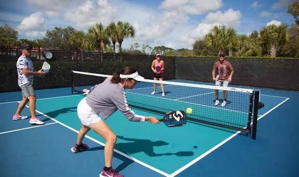 Players enjoying recreational pickleball outdoors